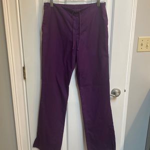 Eggplant colored scrub pants. Flared bottom.